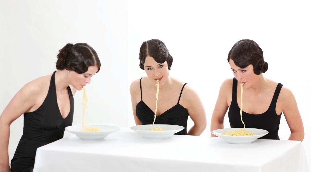 Portrait of a woman eating pasta